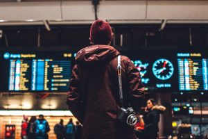 A traveler checking the flight list