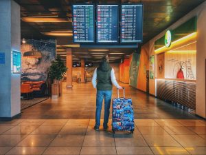 A traveler checking the flight list