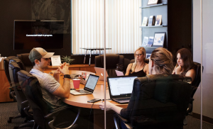 An office meeting involving digital signage