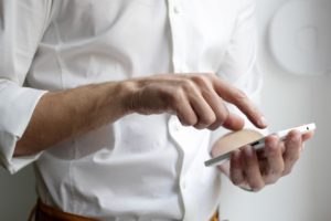 A man using a touchscreen device