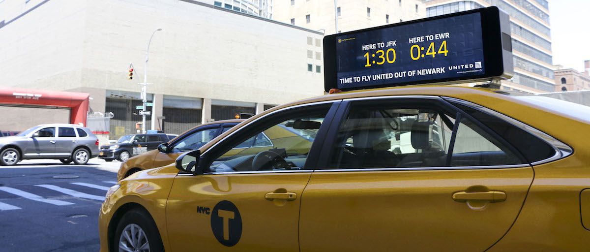 Vehicle mounted digital signage on taxis